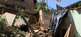 Parte do muro caiu e atingiu a sala de uma residência no bairro Aparecida, em Cariacica(Reprodução | Samy Ferreira, da TV Gazeta)
