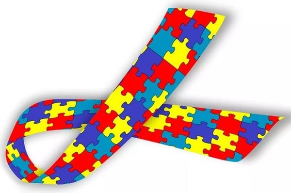 Símbolo do autismo é uma fita, feita de peças de quebra-cabeça coloridas.