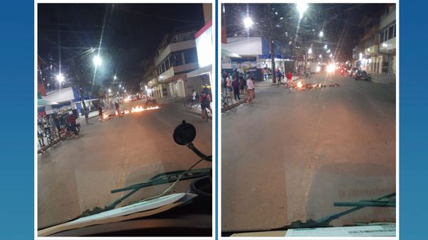 Fotos mostram objetos em chamas no meio da avenida Muriaé, em Nova Carapina II, na Serra, durante manifestação nesta terça-feira (12)