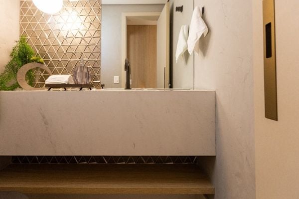 Lavabo com bancada e cuba esculpida de mármore 