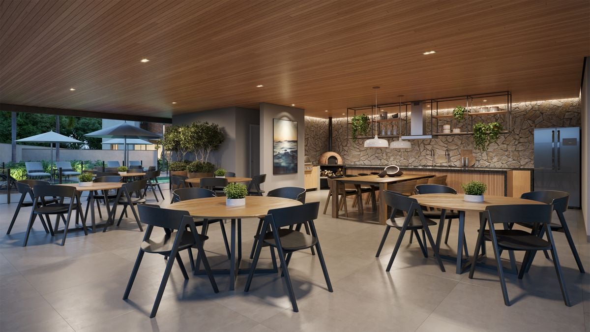 O condomínio contará com uma área gourmet completa, equipada com forno de pizza, churrasqueira e fogão, tudo integrado a um salão e à área da piscina por Octo Empreendimentos/Divulgação