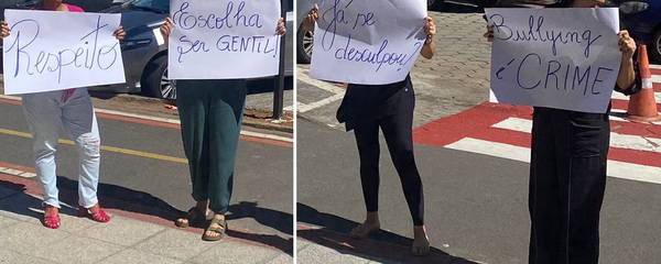 Imagem mostra pais protestando na quinta-feira (8) em frente ao Salesiano de Jardim Camburi por causa de bullying contra as filhas