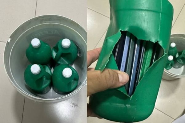 Detalhe de garrafa de água sanitária com celulares dentro, que foi encontrado em penitenciária de Cuiabá (MT) Imagem: 