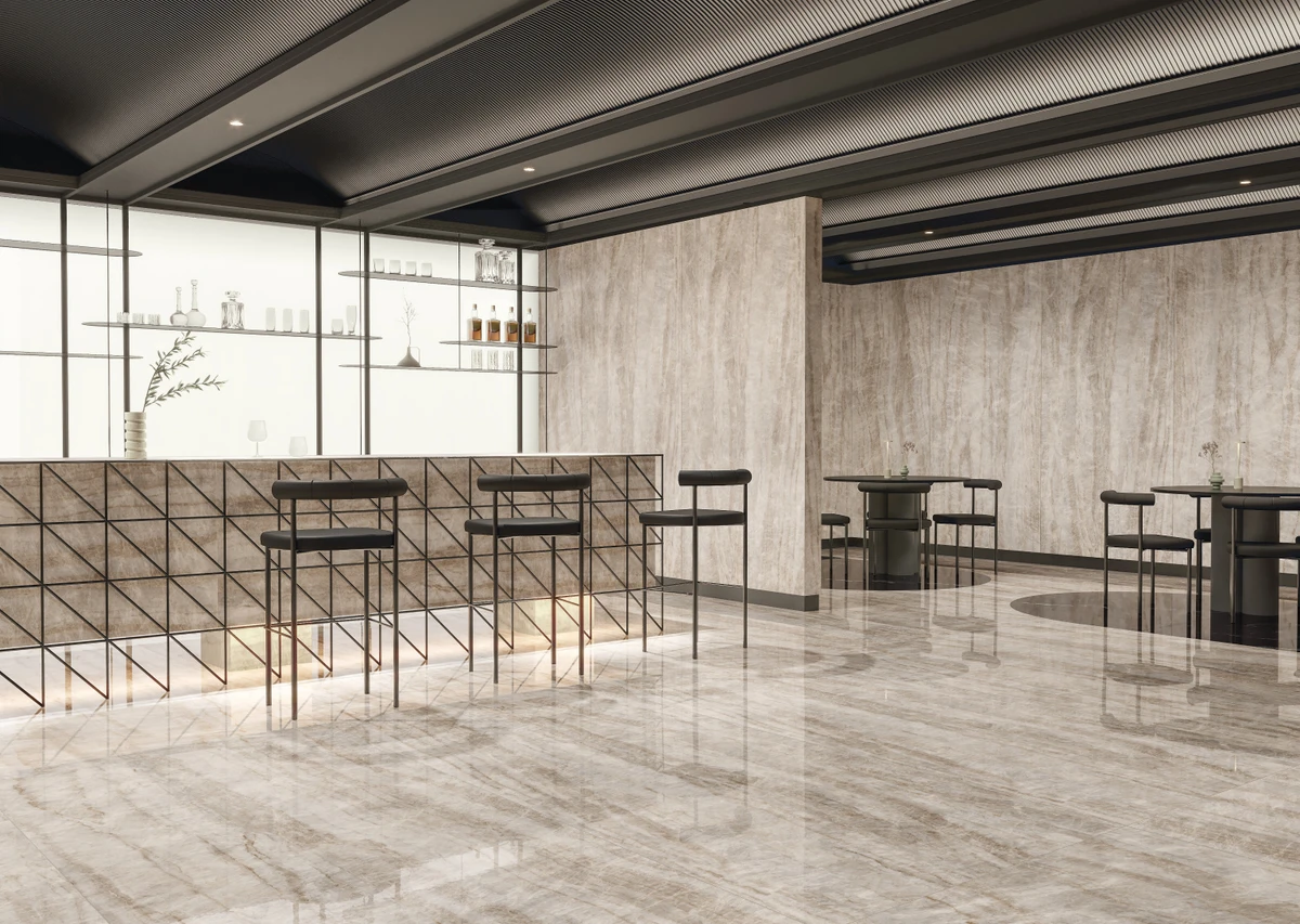 Ambiente com revestimento de porcelanato com impressão que imita pedras naturais por Composé