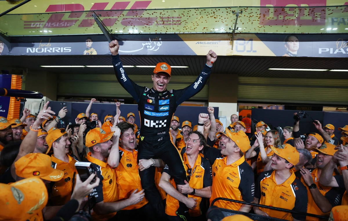 McLaren's Lando Norris celebrates with this team after becoming the 2025 Formula One World Champion 